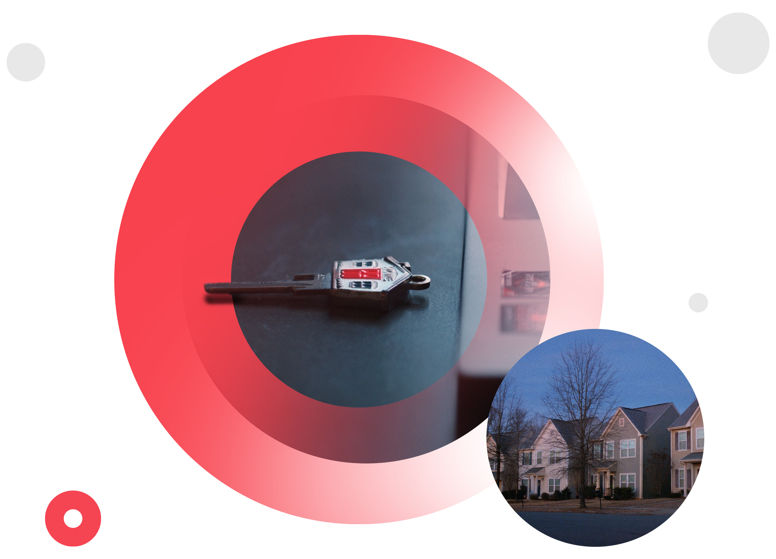 Key on table next to a computer, image of house