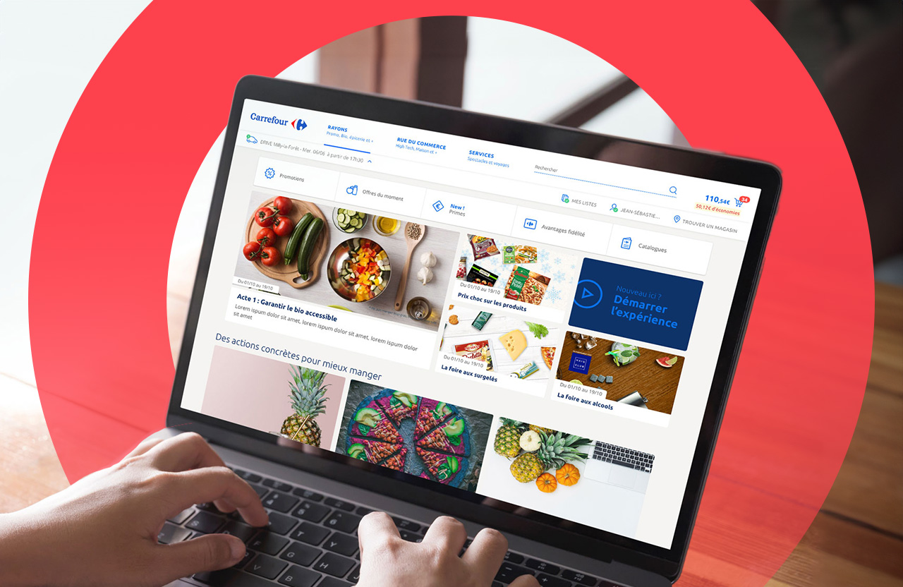 Laptop showing Carrefour website onscreen