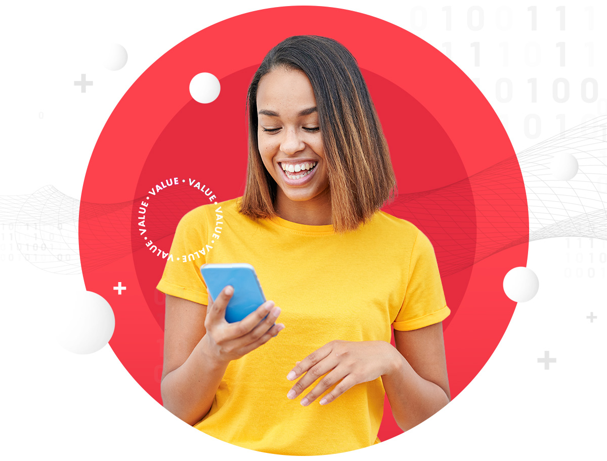 Smiling woman looking at mobile phone in her hand