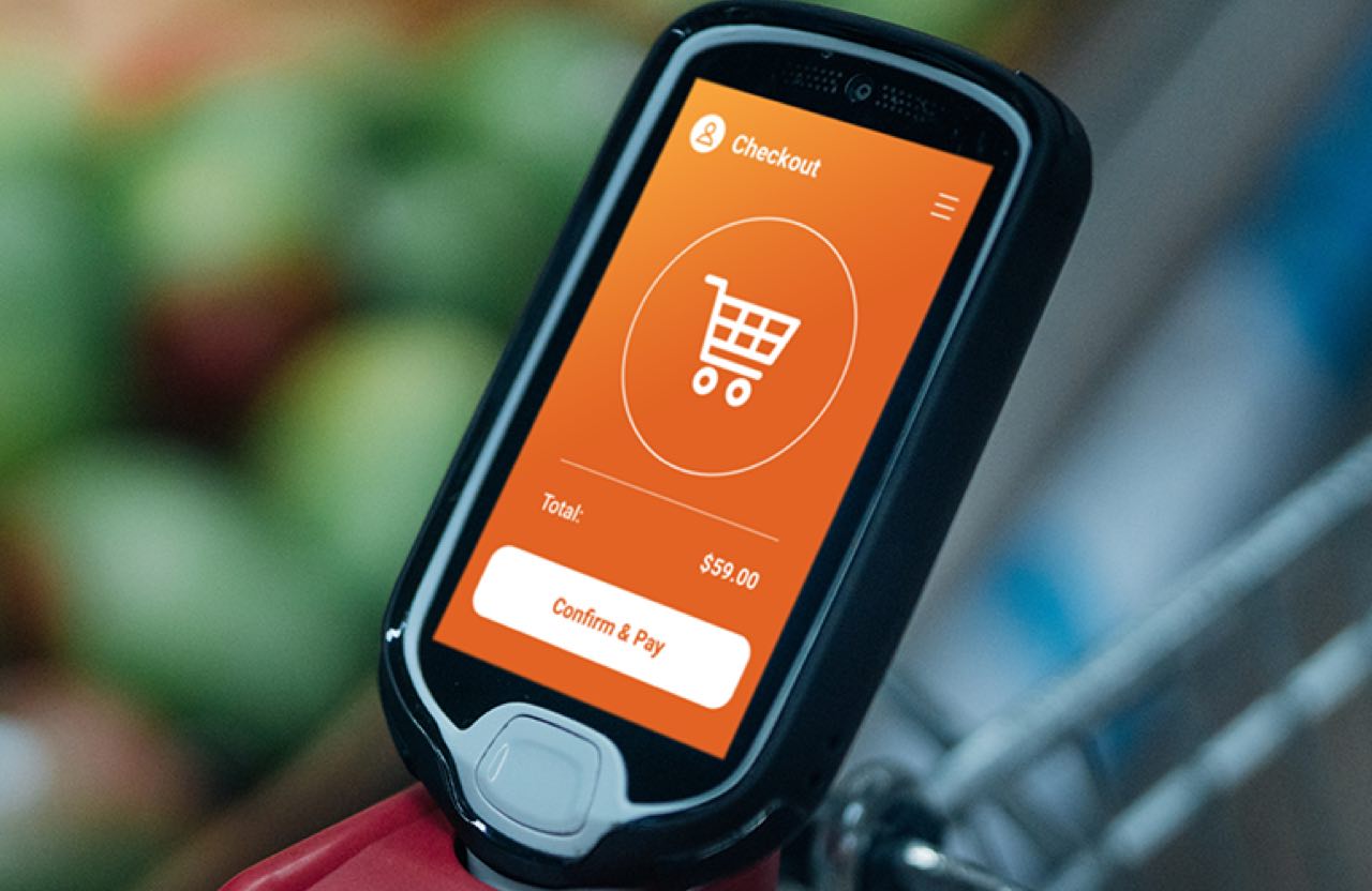 Digital price scanner built into shopping cart for customer self-service