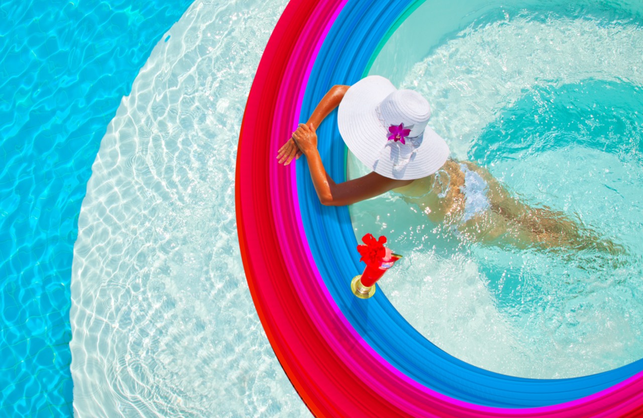 woman enjoying pool at resort