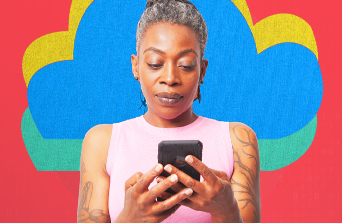 person reading mobile device screen surrounded by colored clouds of data