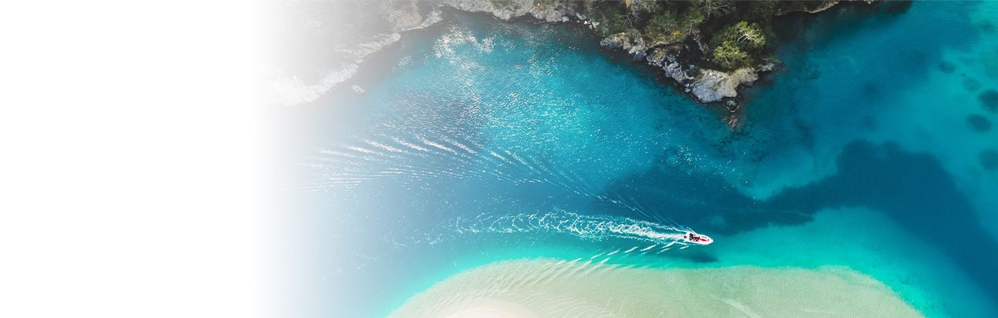 Boat floating near a beach