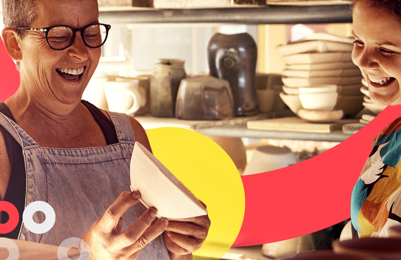 Smiling people looking at a white bowl
