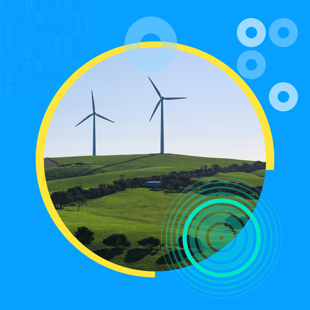 Windmills in the middle of a green meadow