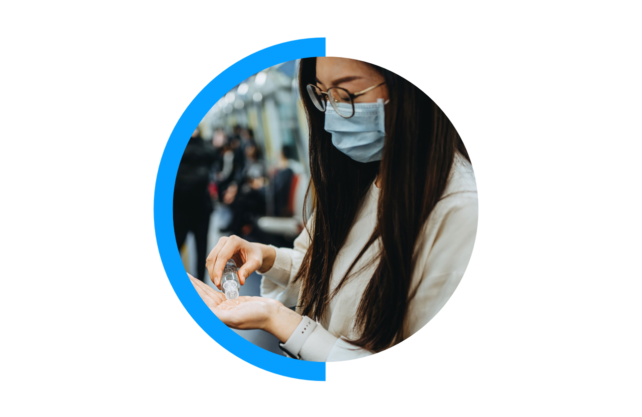 Person on subway cleaning hands