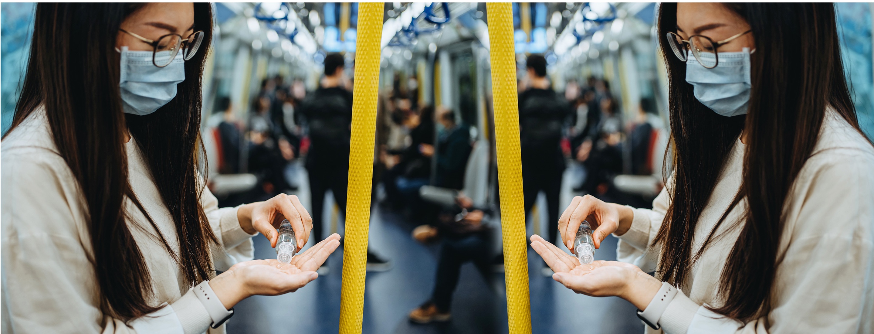 Person riding public transportation while using hand sanitizer