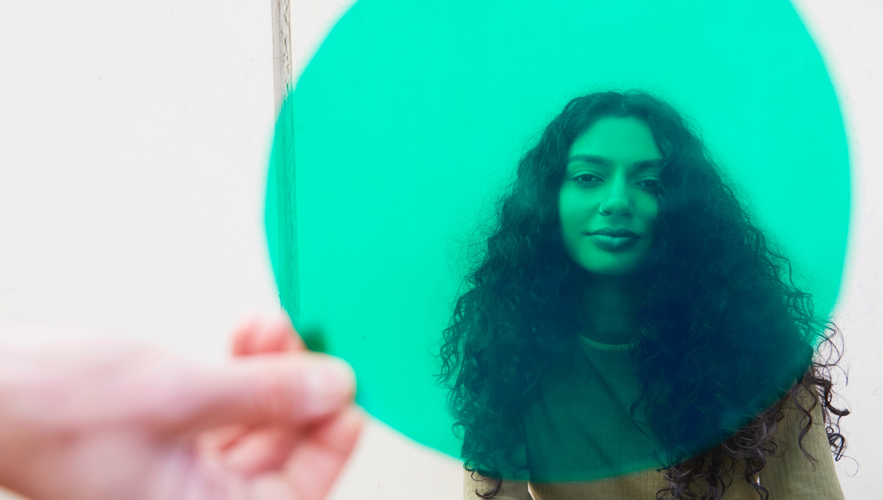 A green circle in front of a person