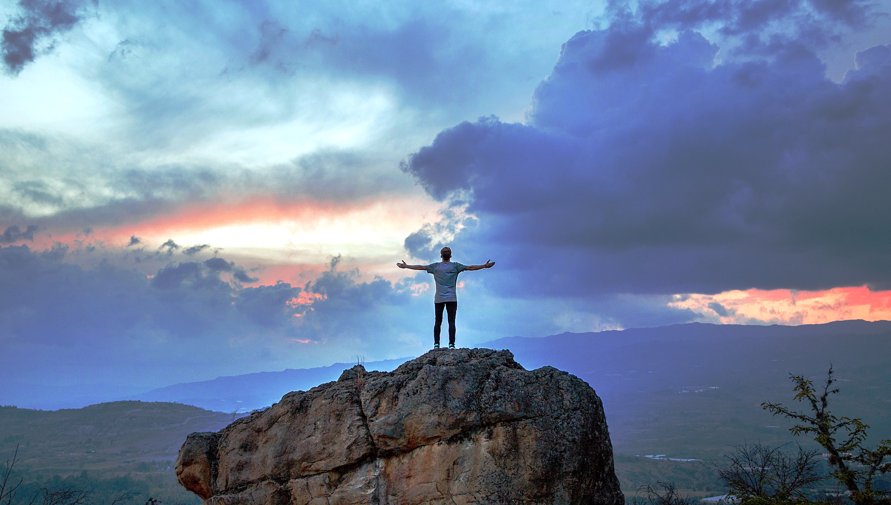 A person in the wide open, celebrating "openness"