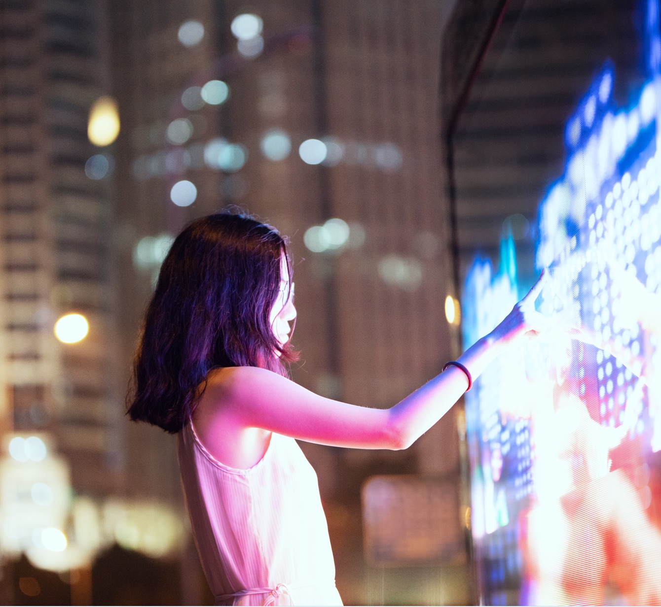 Woman at a  digital travel map