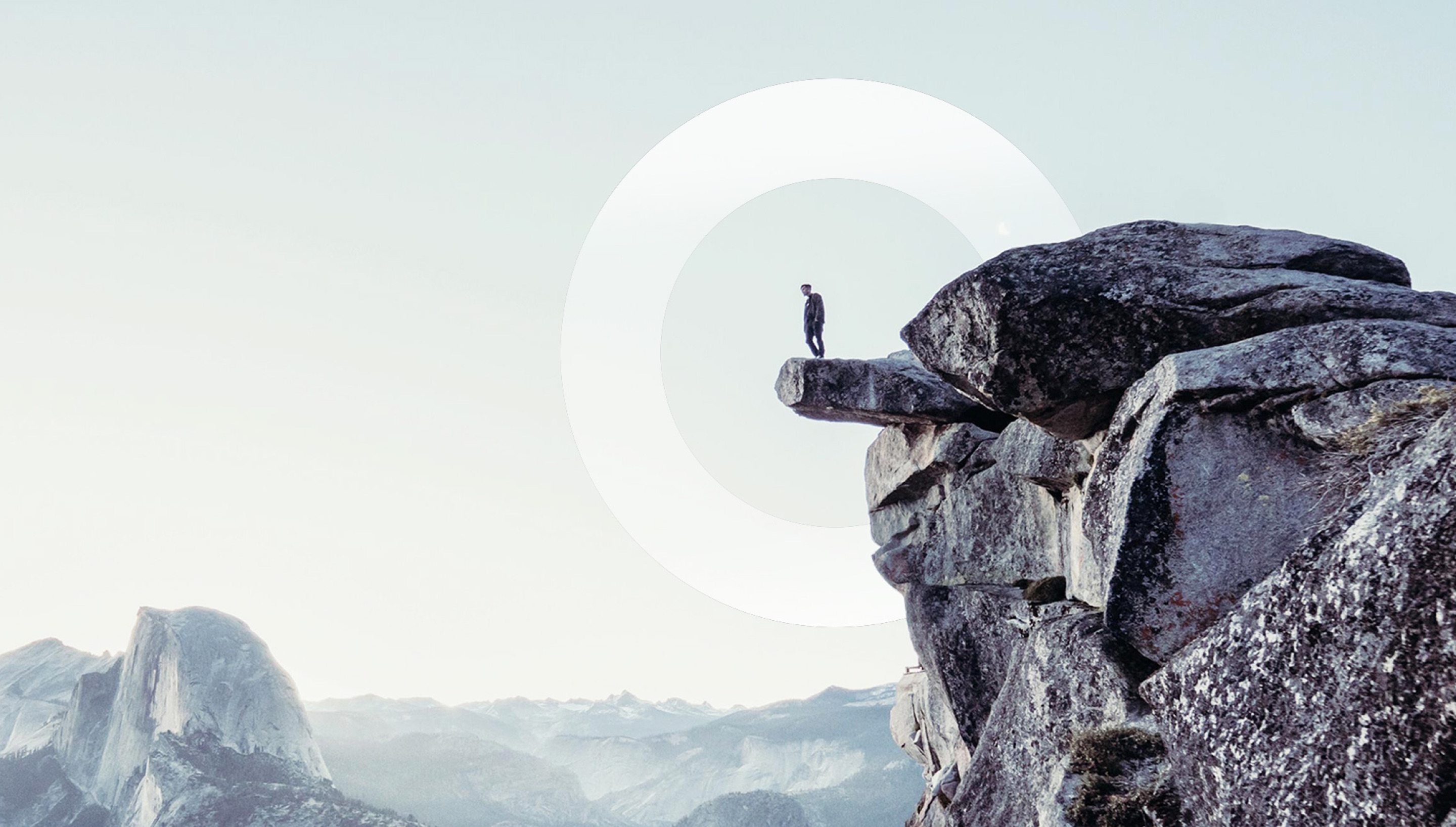 Person looking to horizon from edge of a cliff