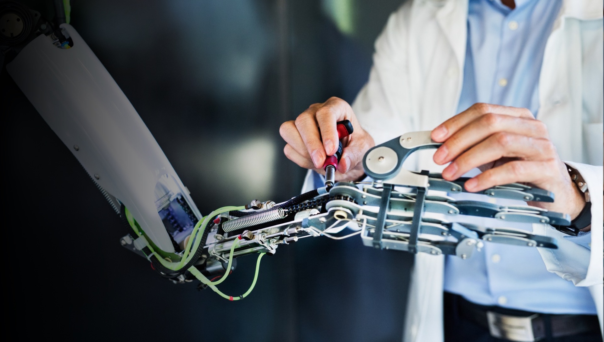 technician working on a robot arm technician working on a robot arm
