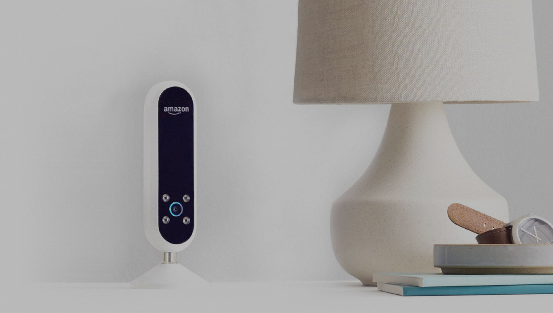 An Amazon Echo on a bedside table