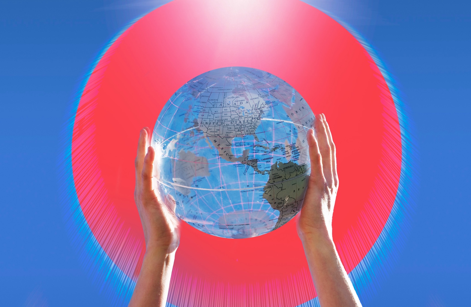 Human hands outreached and holding world globe to view