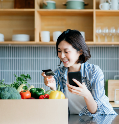 Shopper orders groceries from mobile phone at home