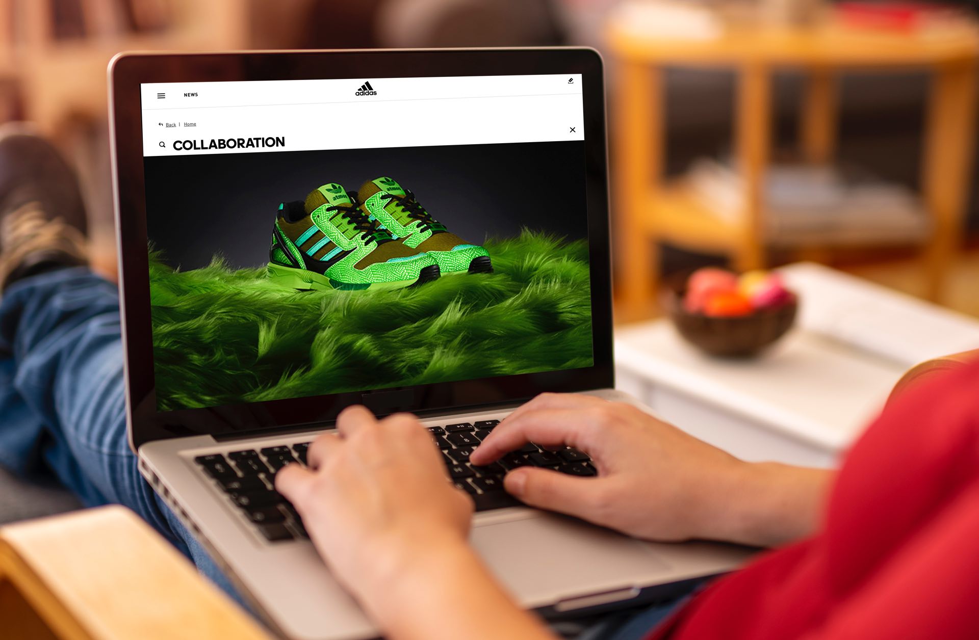 Shopper visits adidas site on laptop