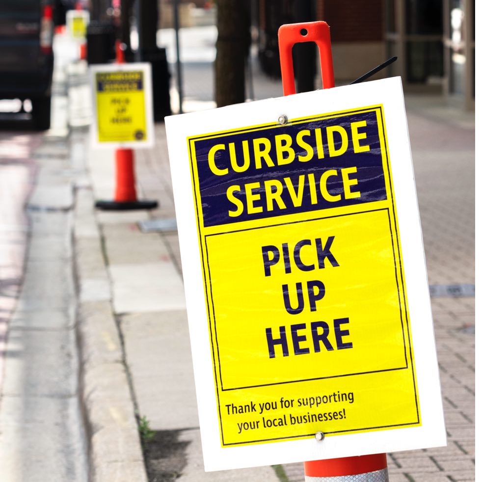 Temporary curbside pickup signs—a hallmark of quarantine.