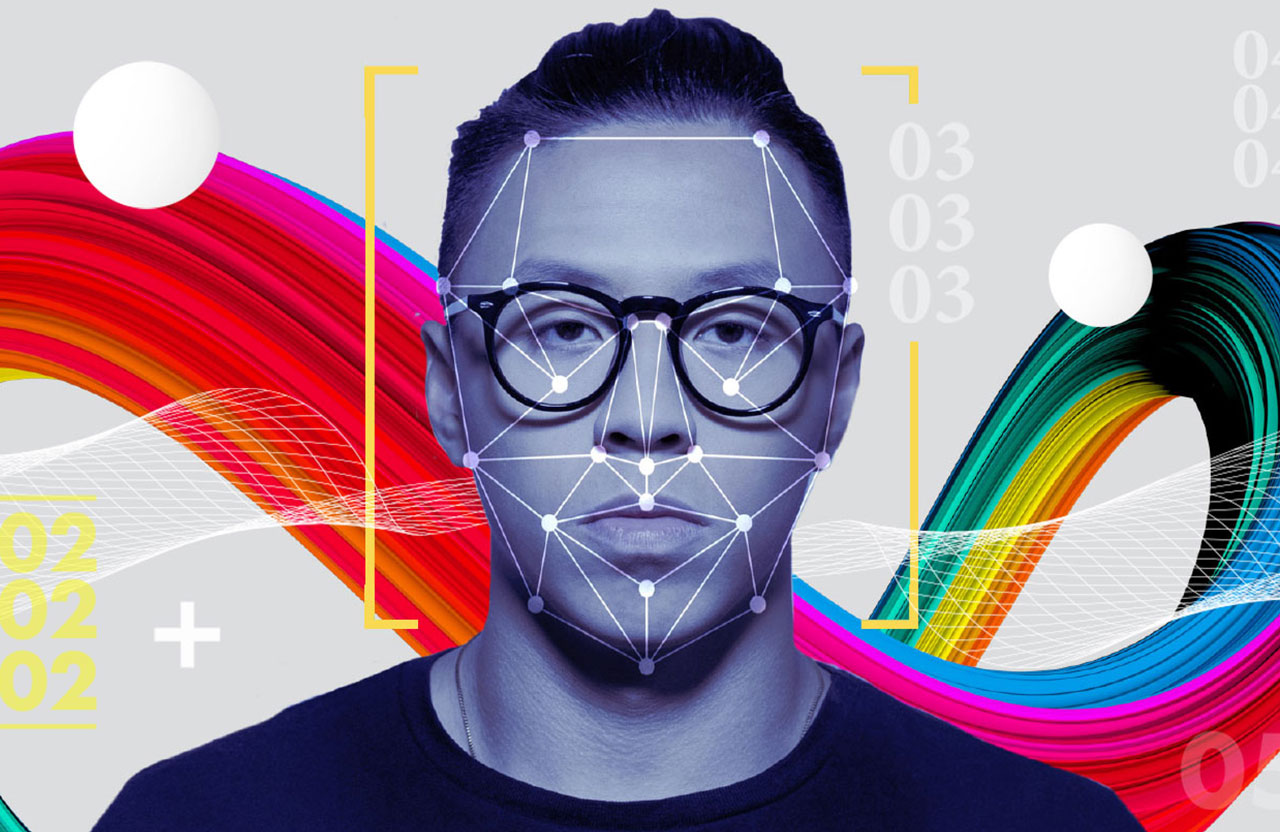 Portrait of man with glasses in front of colorful abstract background