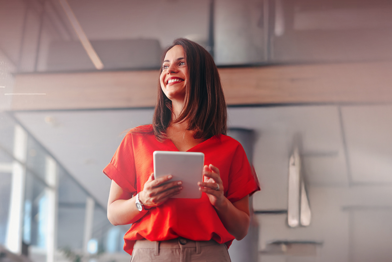Smiling woman holding ipad