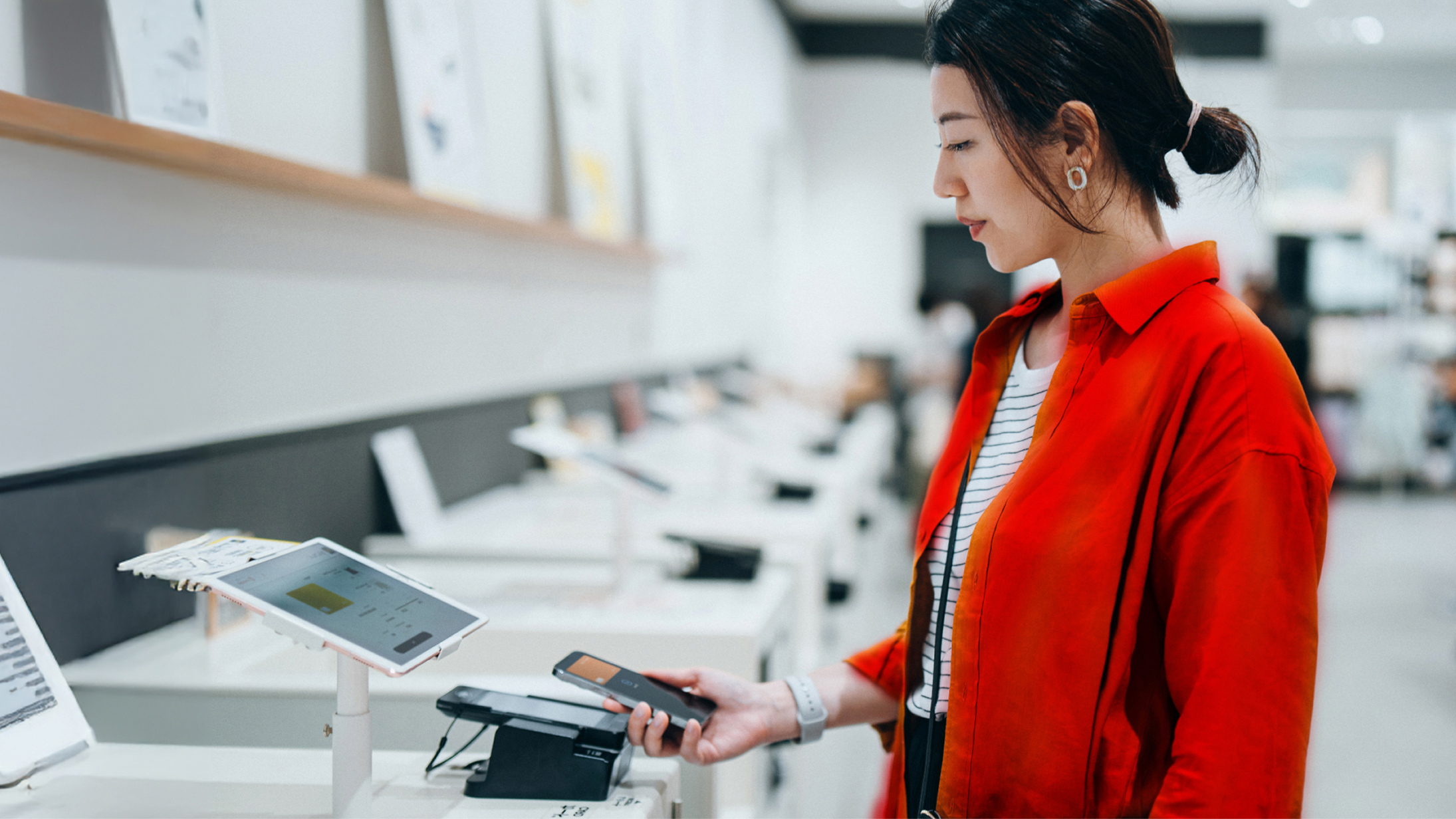 woman using mobile device to scan screen
