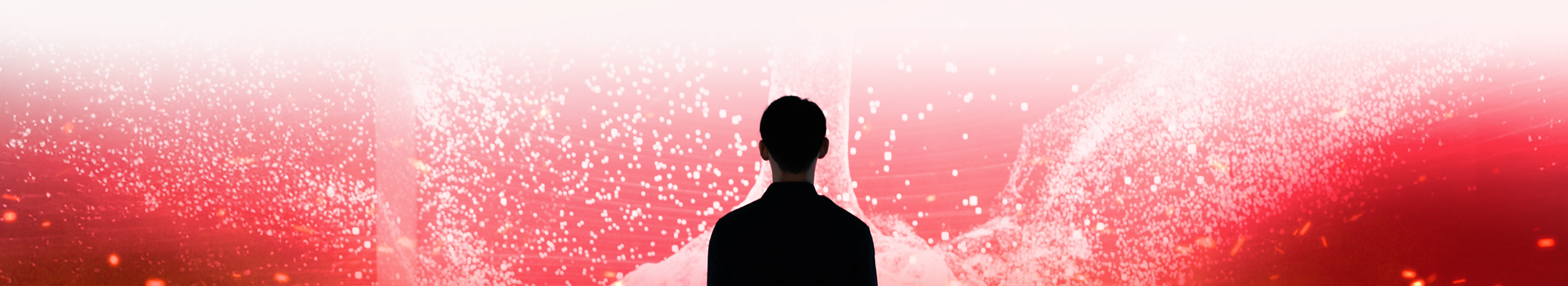 Silhouette of a man faces an explosion of red and white in an abstract visual.